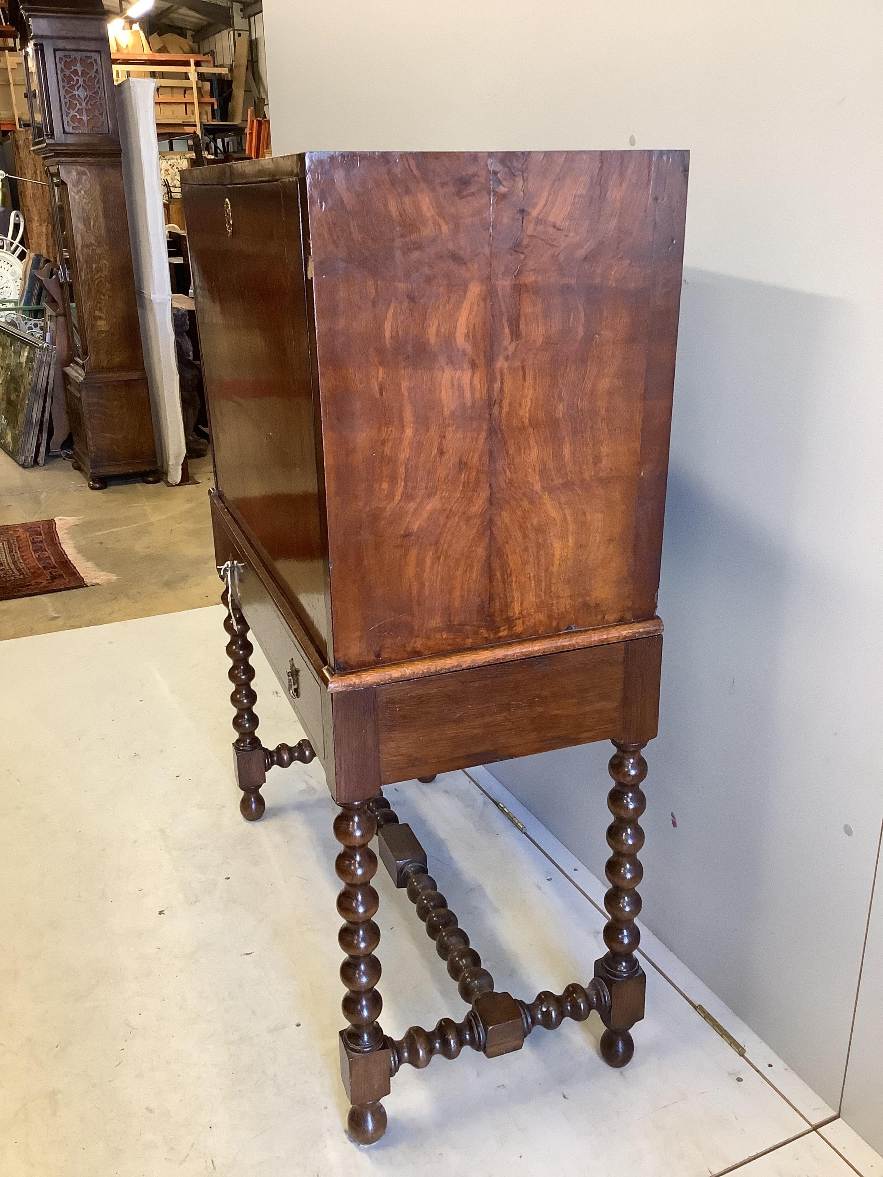 An 18th century walnut secretaire cabinet on later stand, width 91cm, depth 44cm, height 130cm. Condition - fair